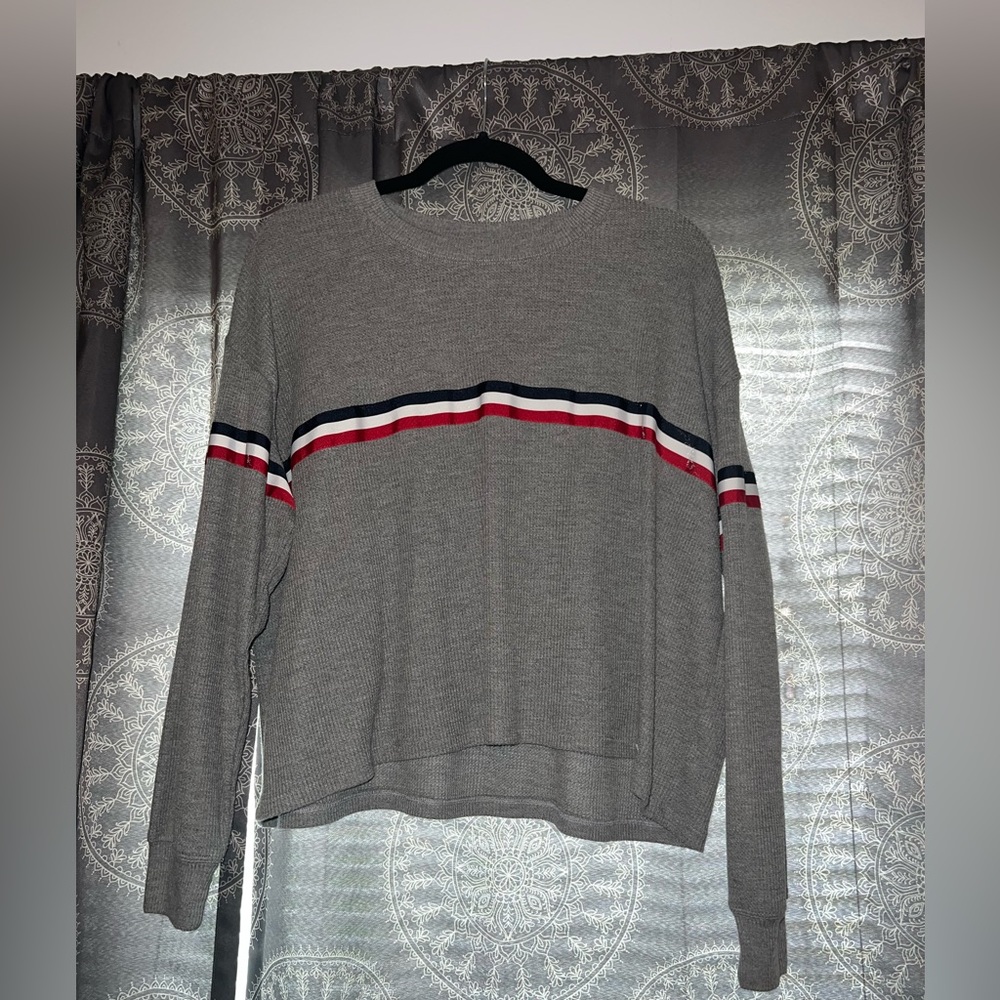 Grey long sleeve with red, white, and blue stripe